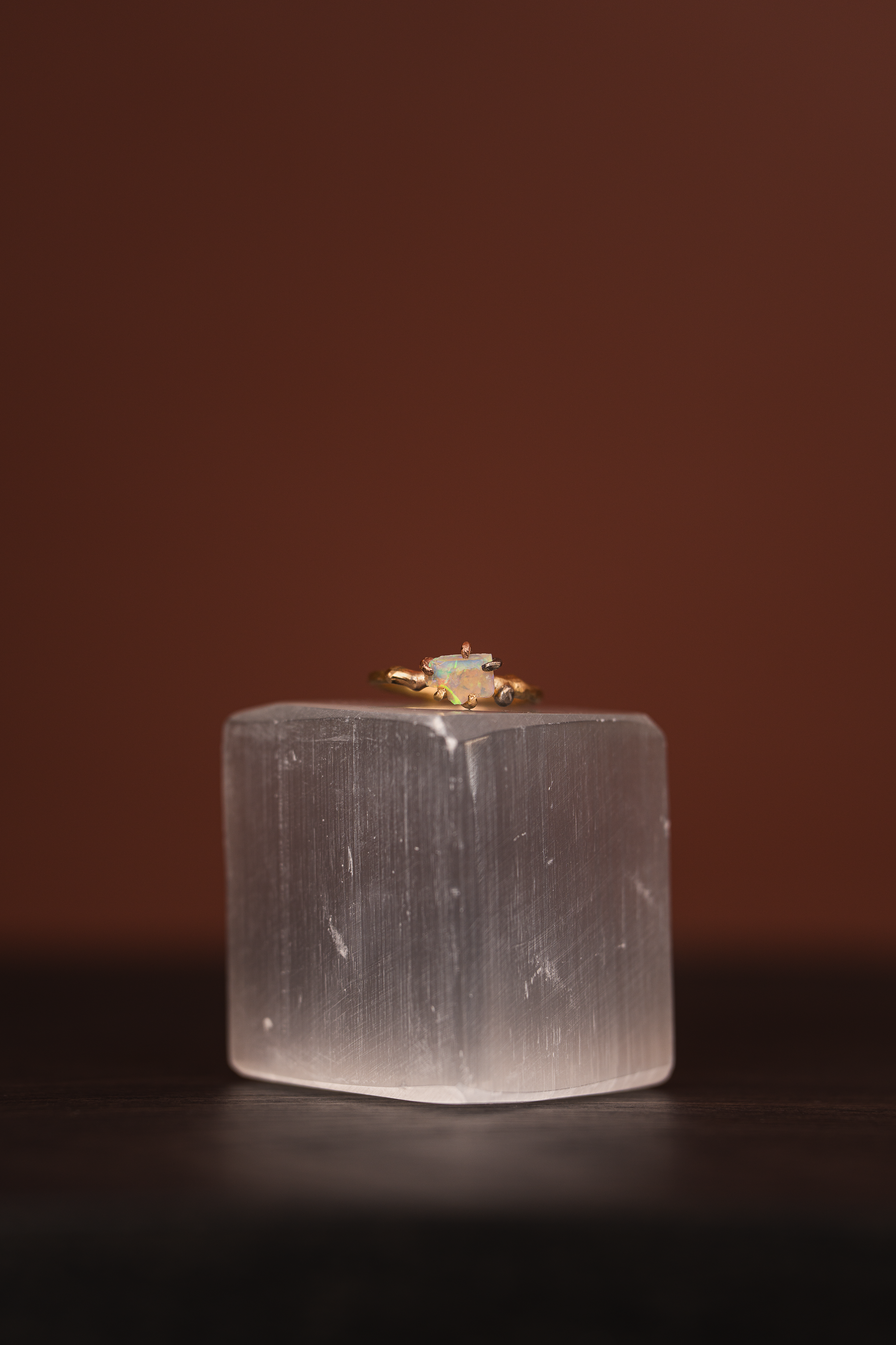 Australian opal small stone ring on a yellow gold band