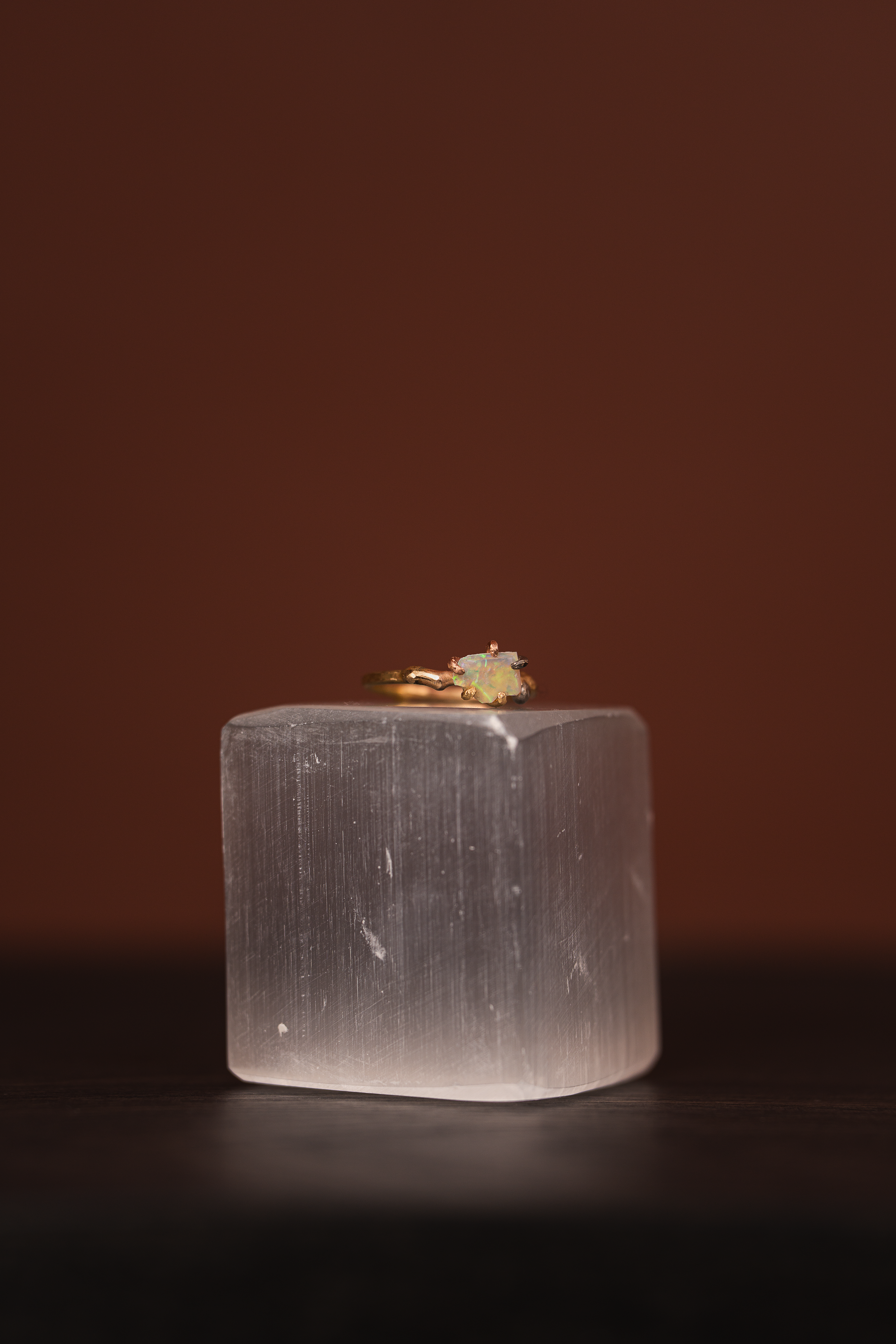 Australian opal small stone ring on a yellow gold band