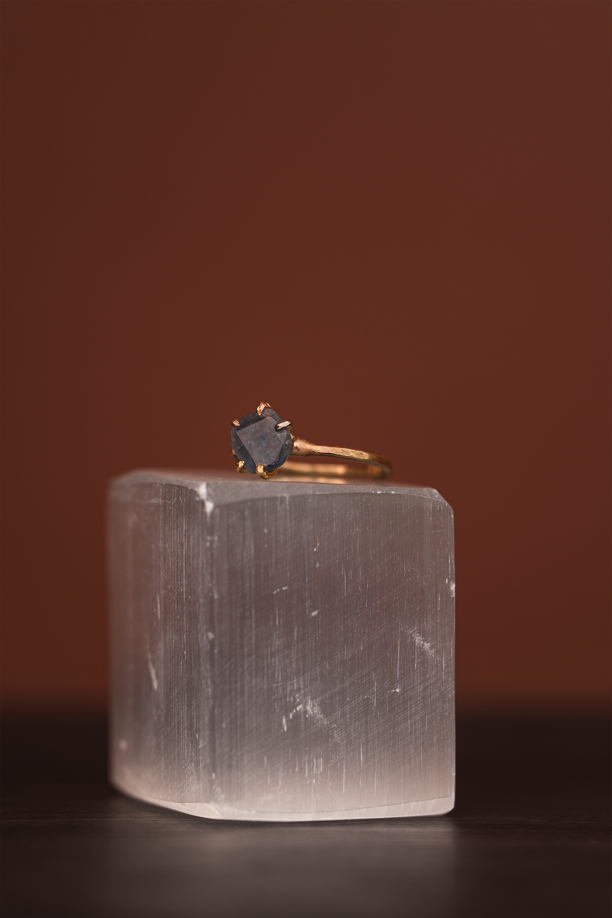 Montana sapphire small stone ring on a yellow gold band