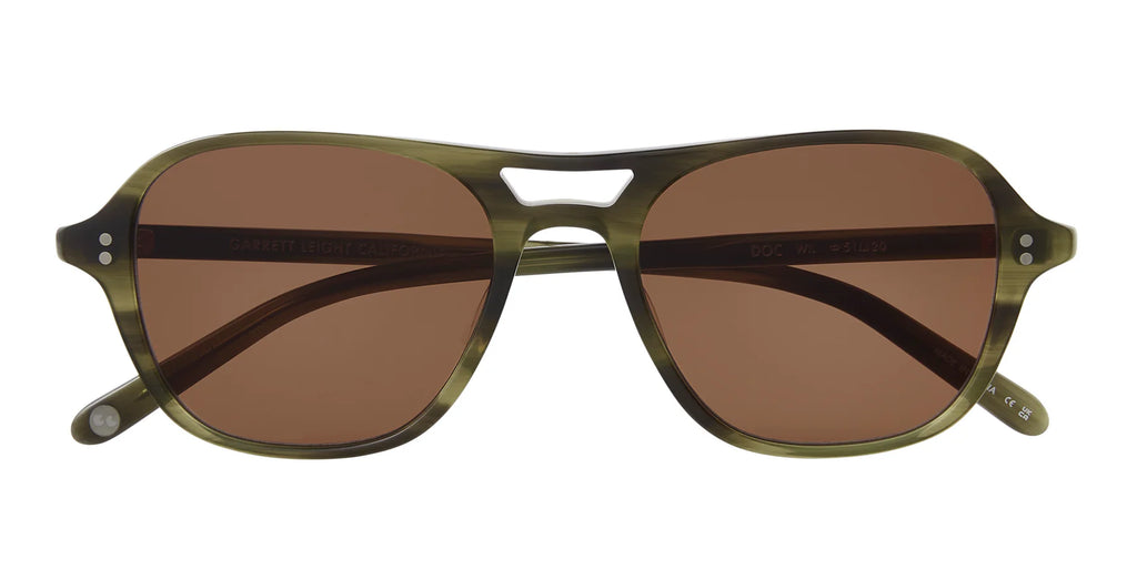 Sunglasses with brown lenses and green frame on a white background