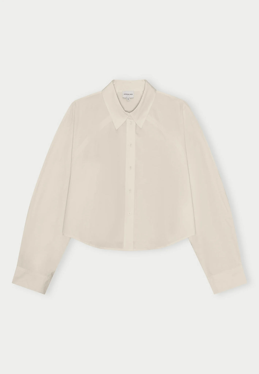 An oyster white Elsie shirt by Herskind against a plain background