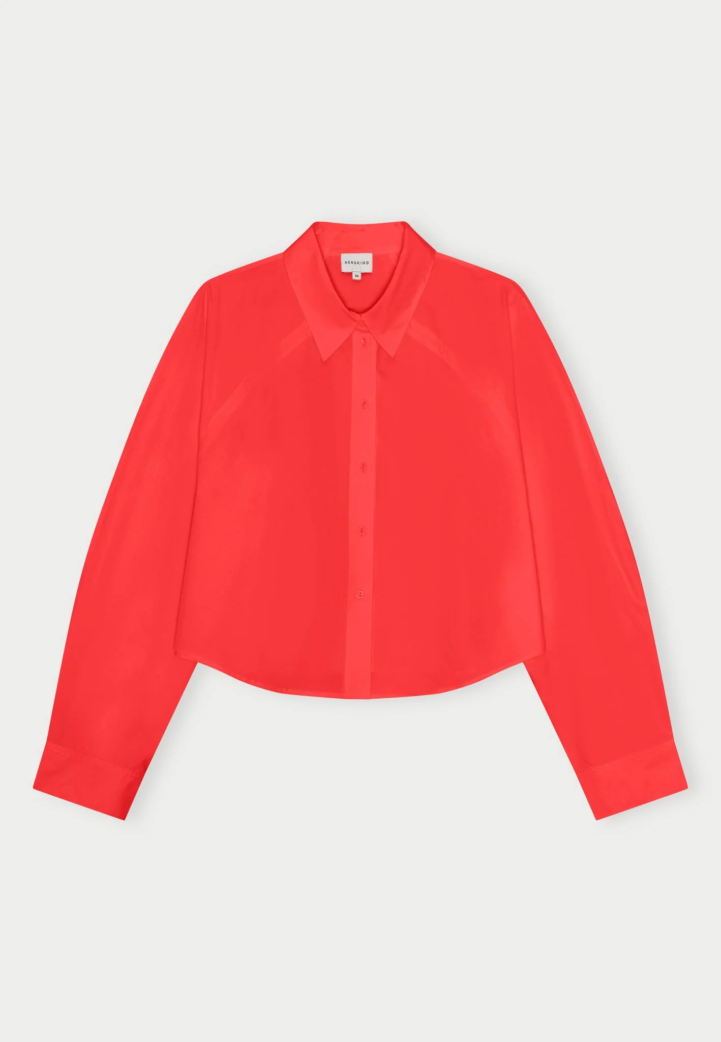 Red Elsie shirt by Herskind against a plain background