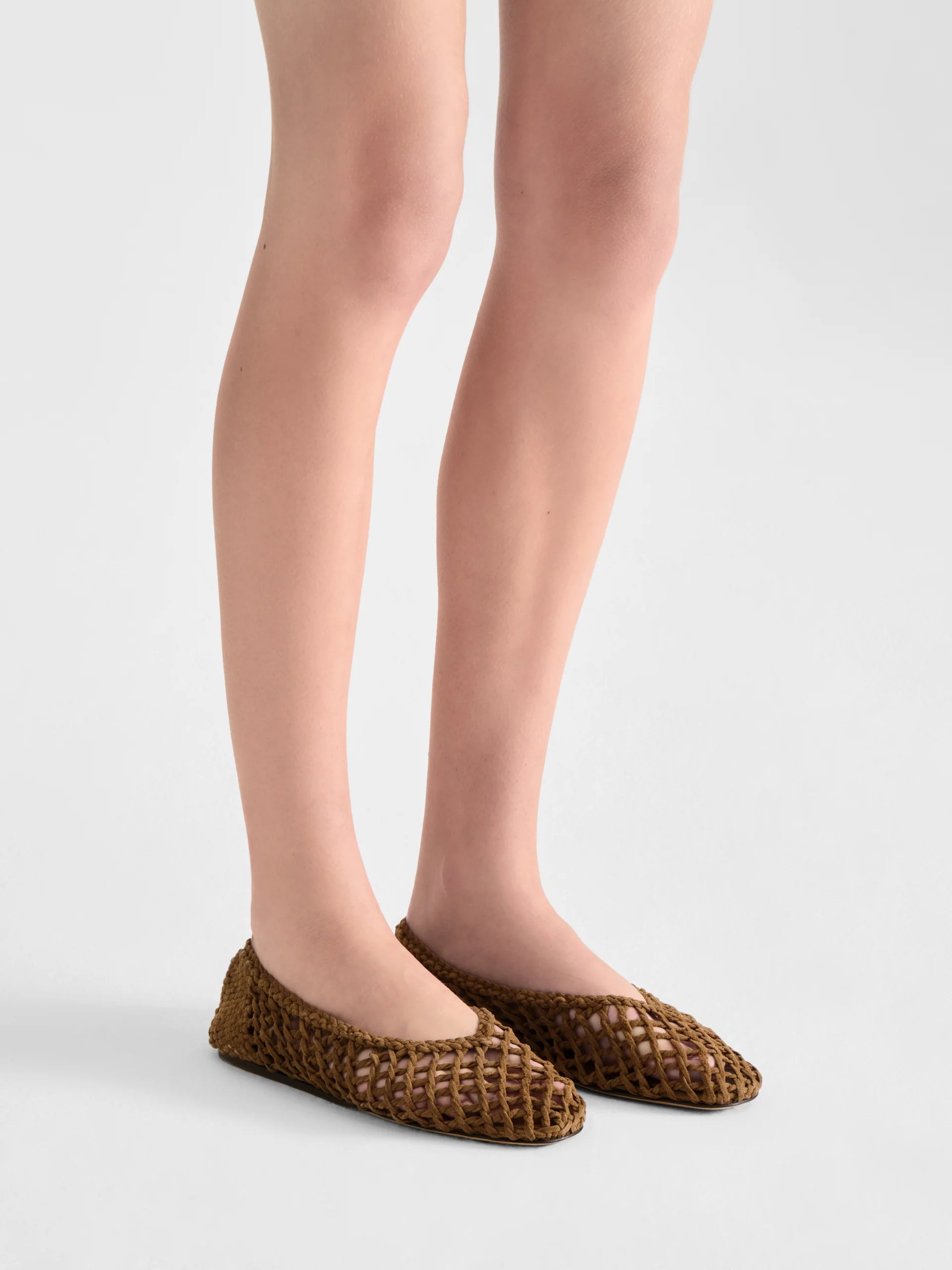 Taupe Suede woven shoes by Le Monde Beryl  worn by a woman on a white background