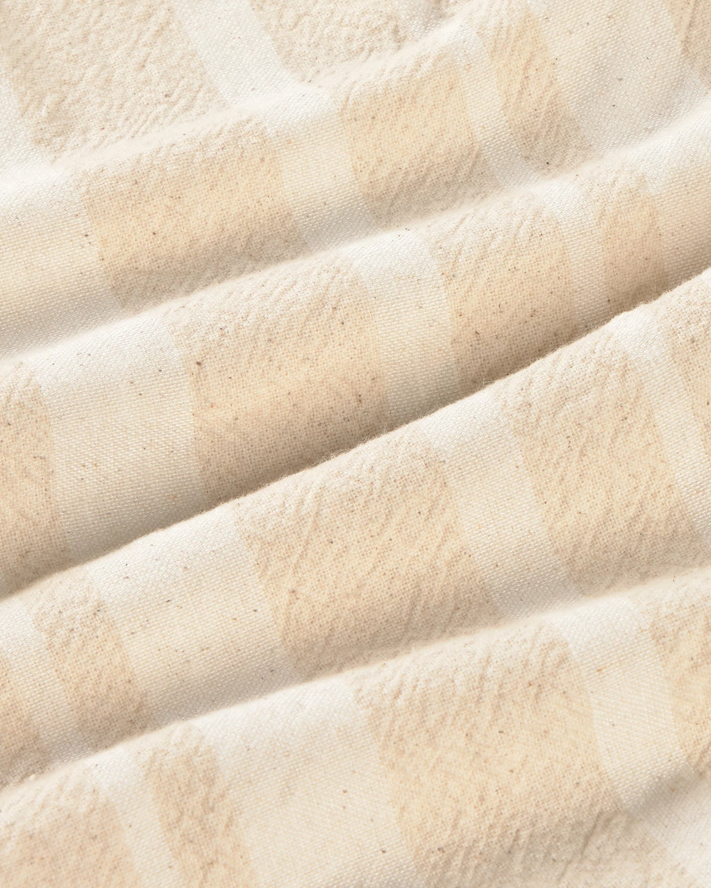 Close-up of raw beige with white stripes fabric texture