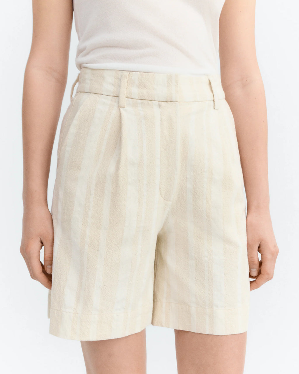 Raw Beige with white shorts worn by a person on a white background