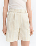 Raw Beige with white shorts worn by a person on a white background