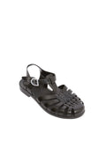 Black jelly sandal with a strap on a white background