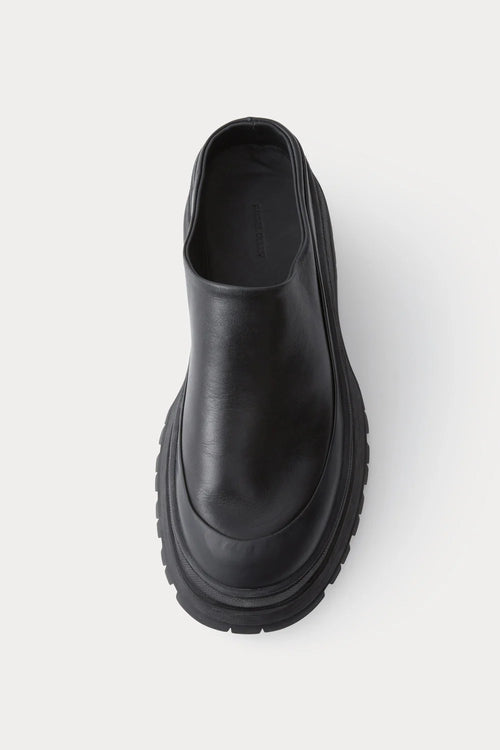 Black leather Slip in Barla Mule by Rachel Comey.