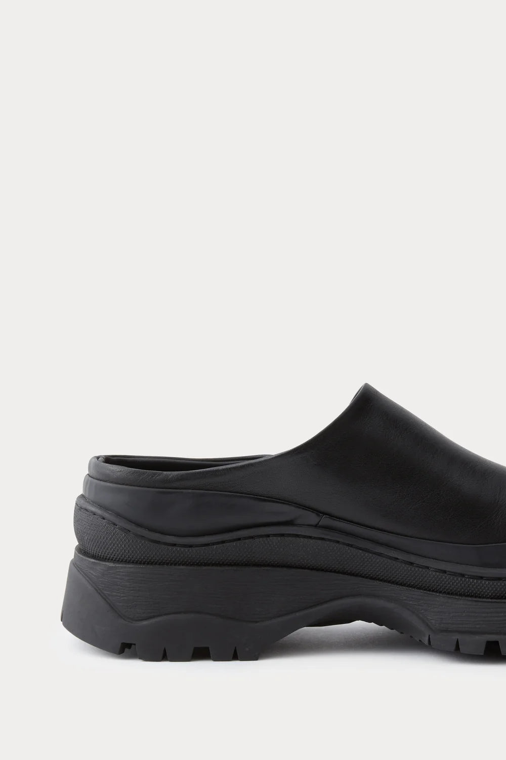 Black leather Slip in Barla Mule by Rachel Comey.