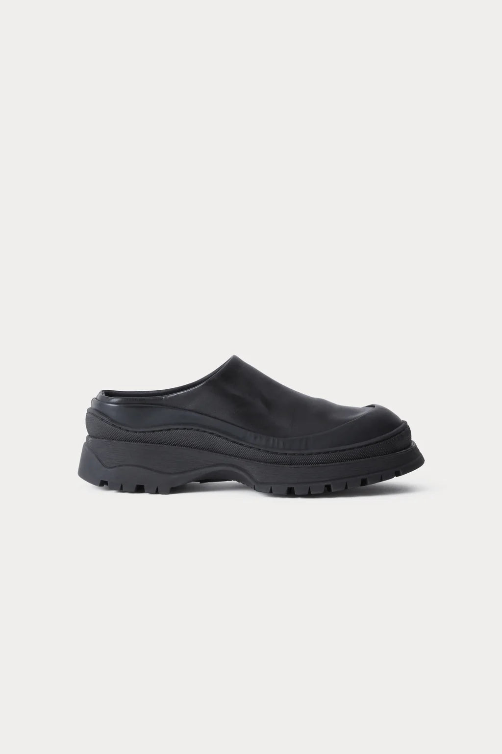 Black leather Slip in Barla Mule by Rachel Comey.