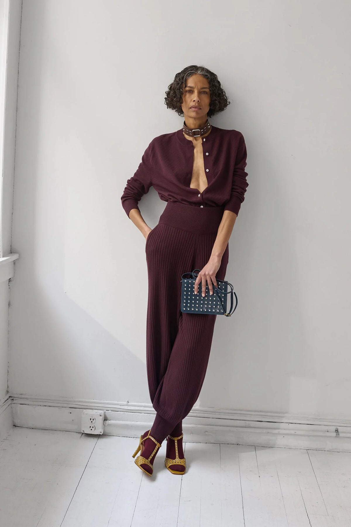 A Model wearing Auburn colored cardigan - Matin Cardigan by Rachel comey and matching pants.