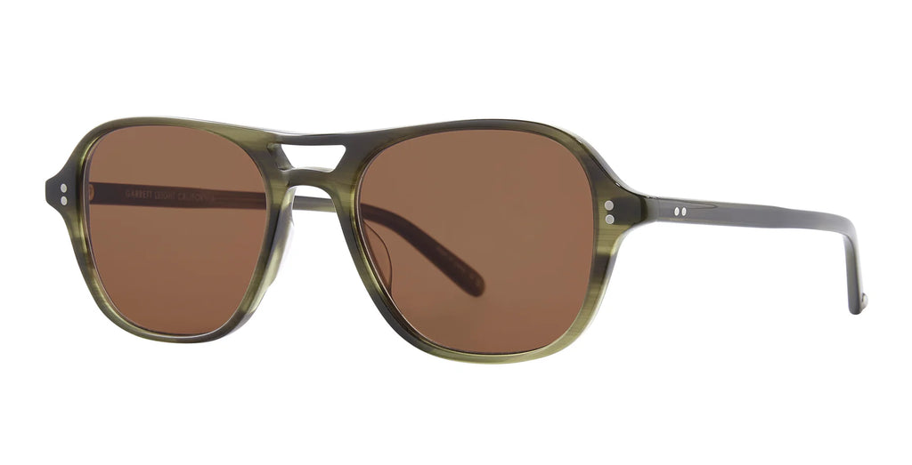 Sunglasses with brown lenses and green frame on a white background