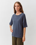 A woman wearing a navy striped tovo t-shirt by Diega