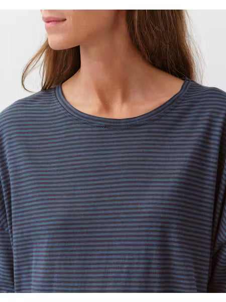 A woman wearing a blue striped tovo t-shirt by Diega