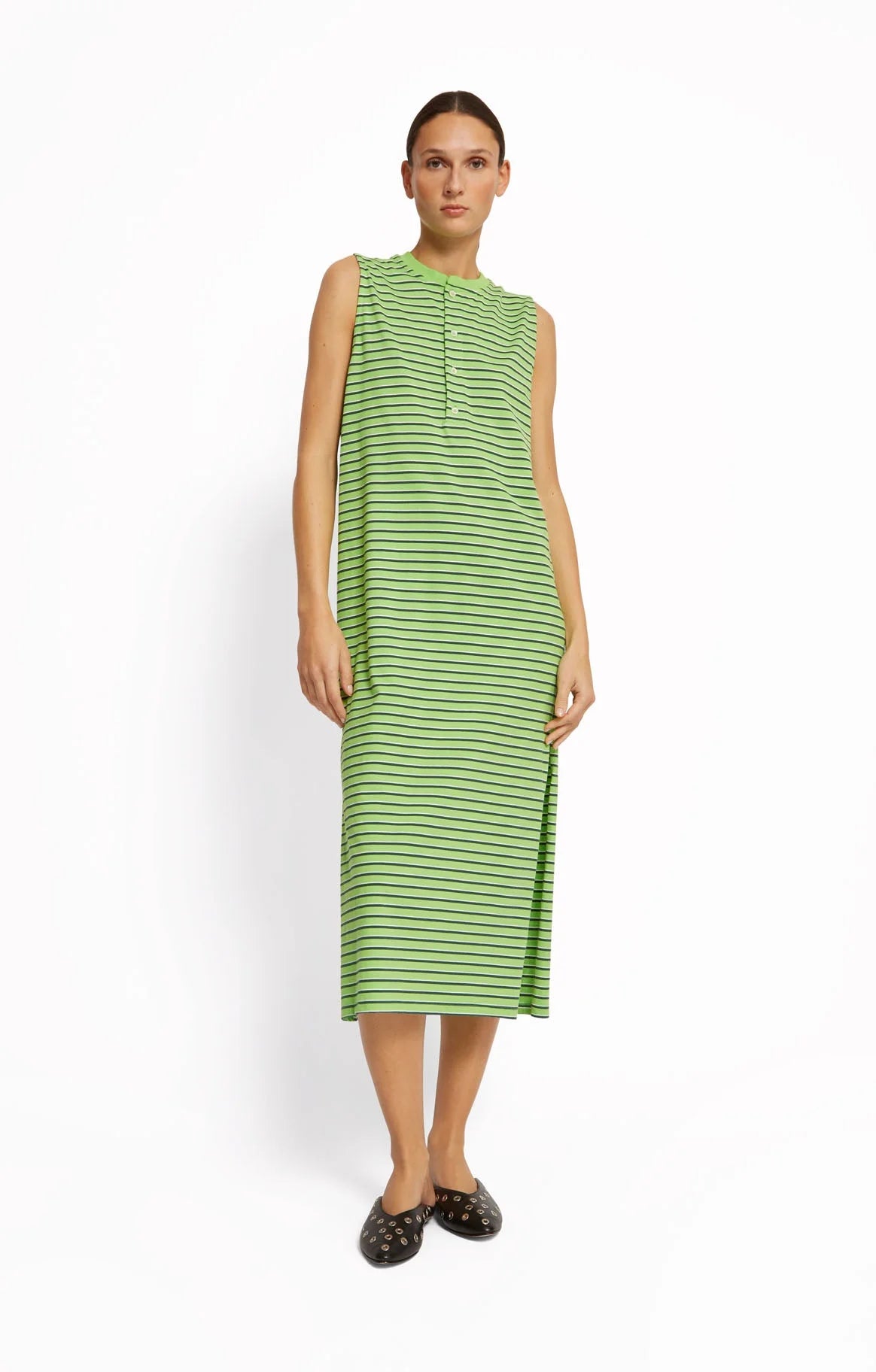 Woman wearing a green striped dress by Roseanna on a white background