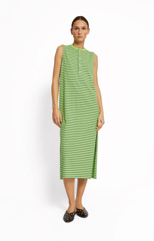 Woman wearing a green striped dress by Roseanna on a white background