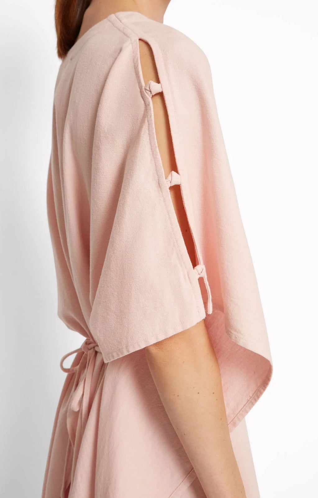 Pink dress by Roseanna with cut-out design on a white background