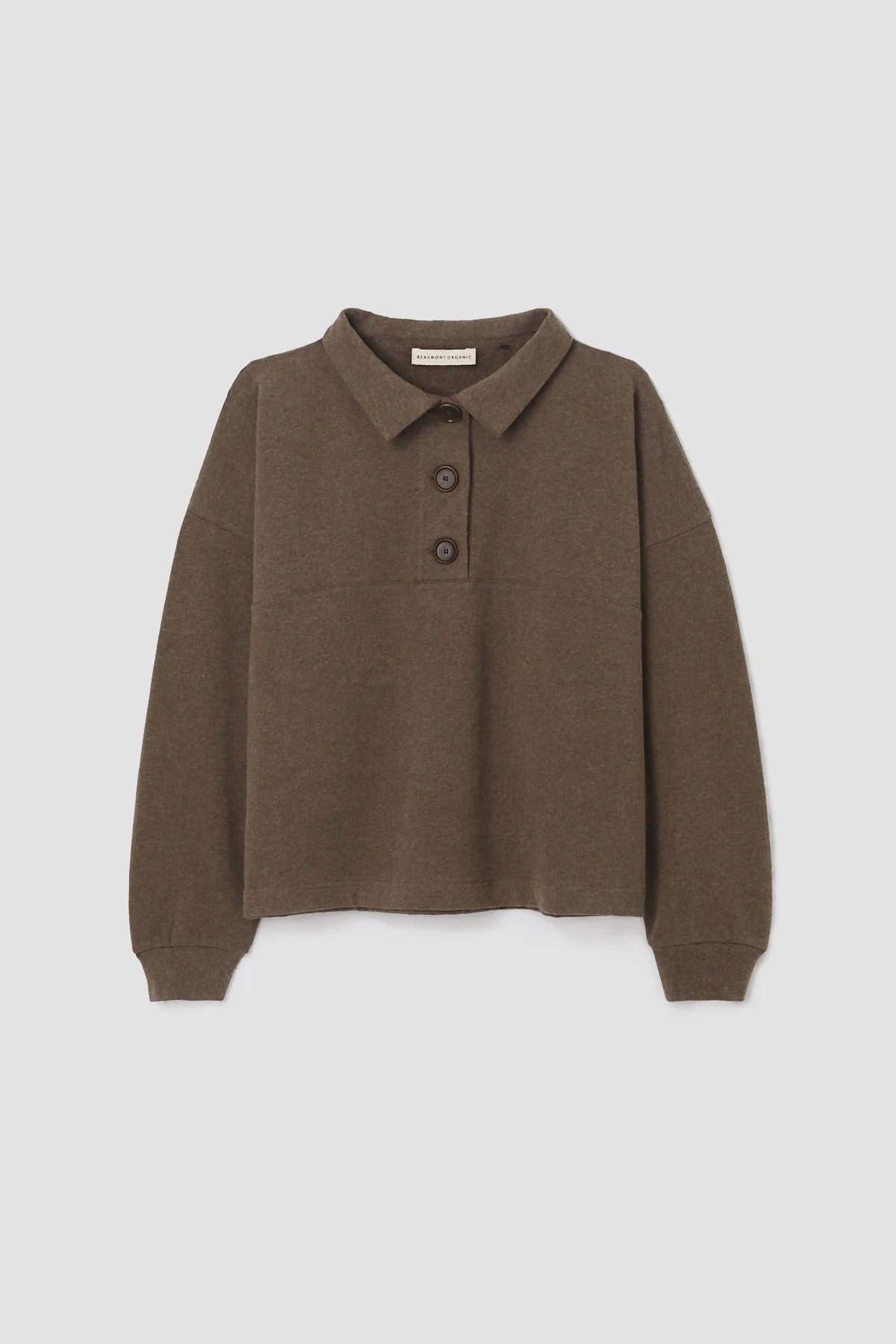 A woman wearing the Holly brown collared Sweatshirt by Beaumont Organic with matching pants.