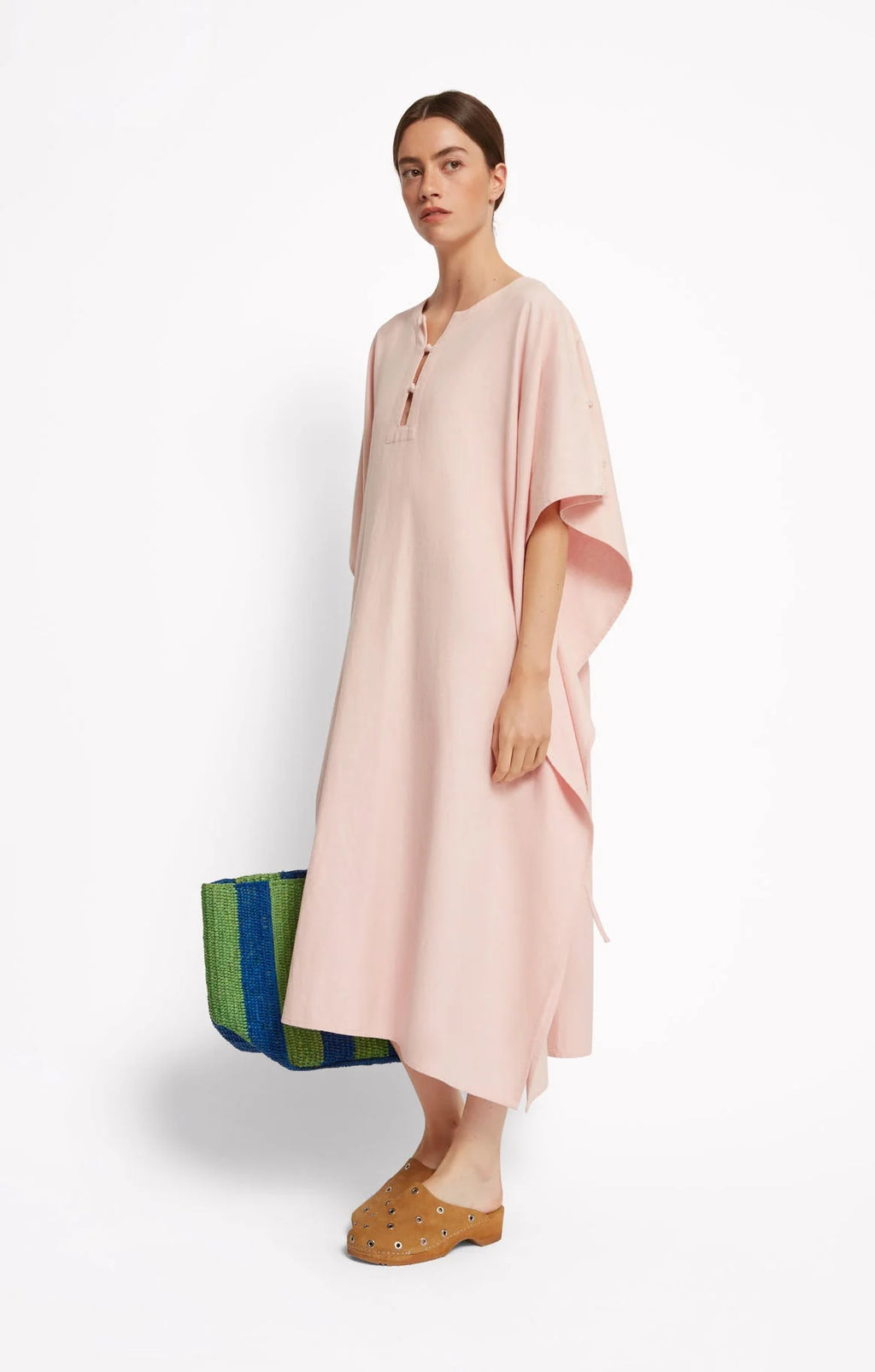 Woman wearing a light pink dress, Roseanna