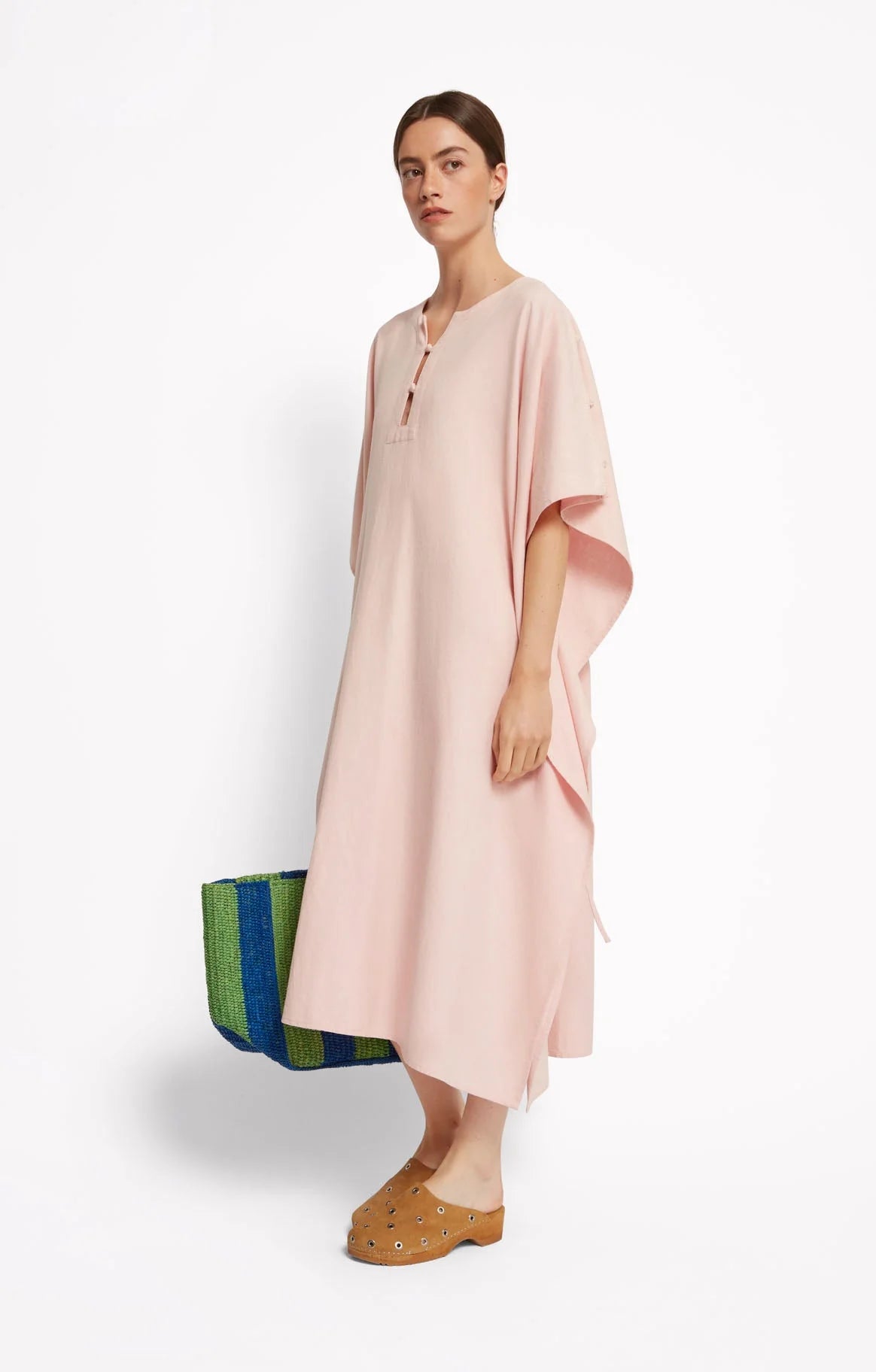 Woman wearing a light pink dress, Roseanna